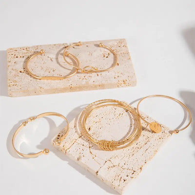 Set di bracciali Knotted Elegance | Oro